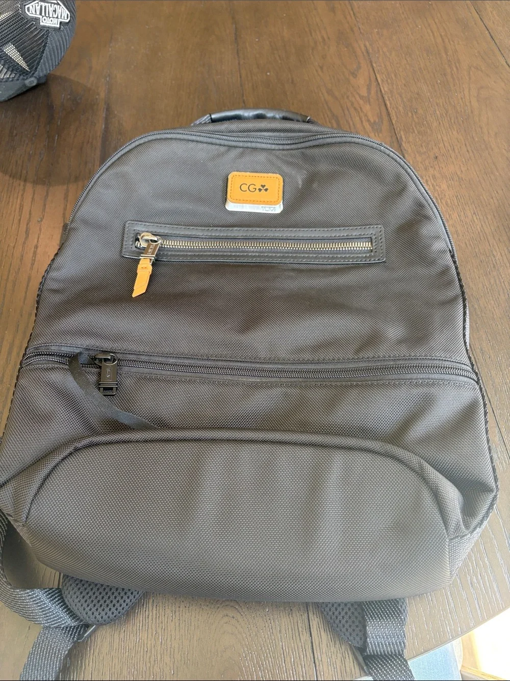 Tumi Black Backpack with Tan Accent